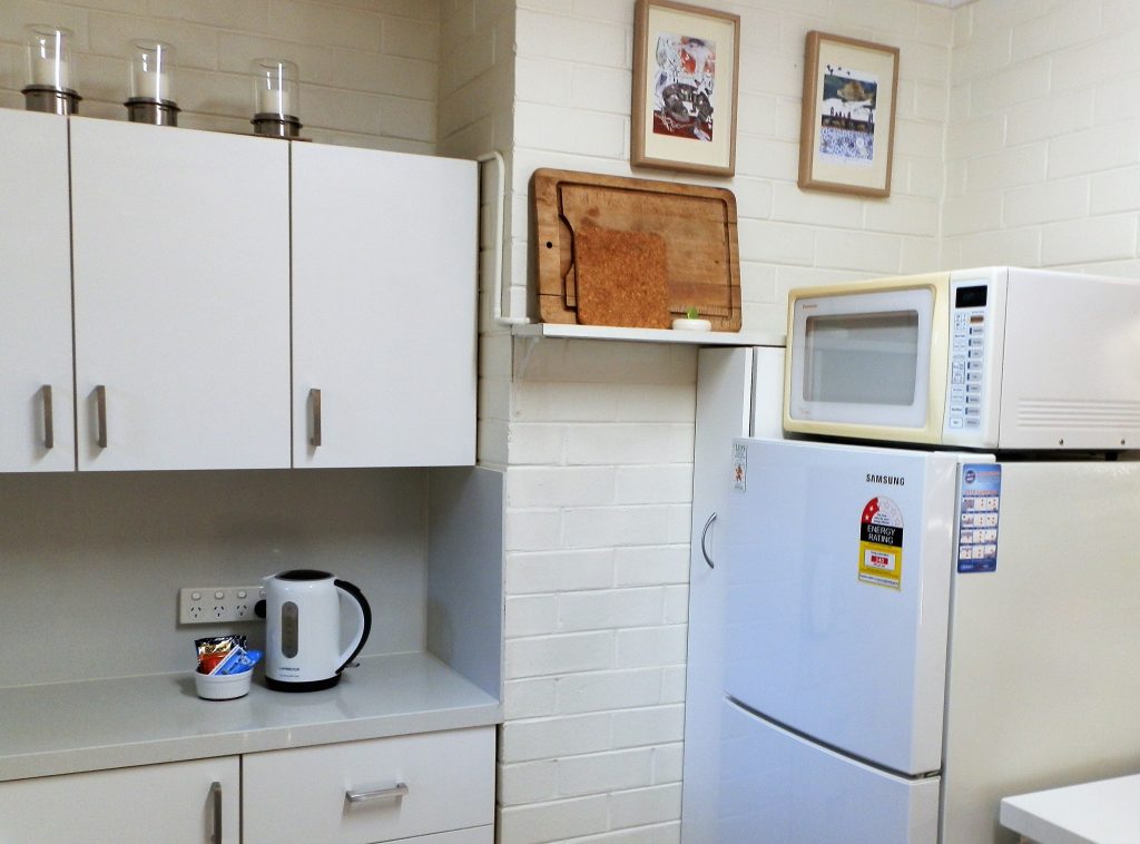 Kitchen with decent sized fridge and microwave at Three on Whatley