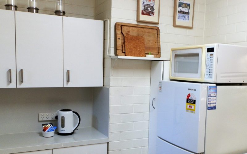 Kitchen with decent sized fridge and microwave at Three on Whatley