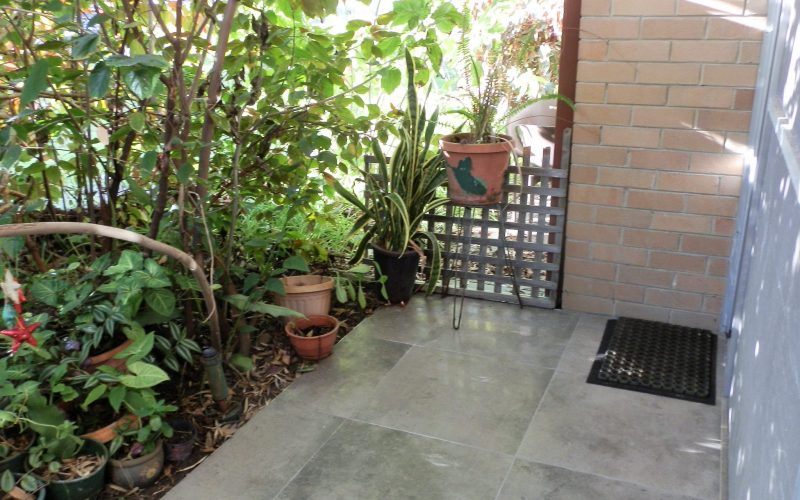 Greenery surrounds the patio at Three on Whatley
