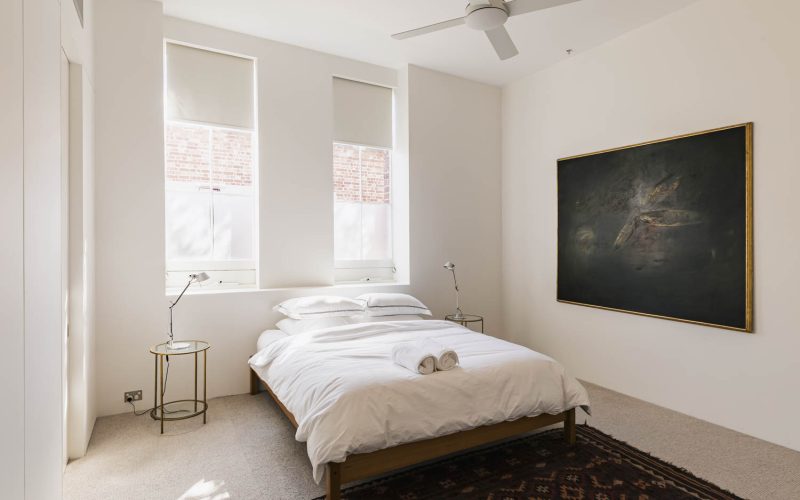 Stylish king sized bedroom in the Architect's Warehouse Apartment 30D Fremantle