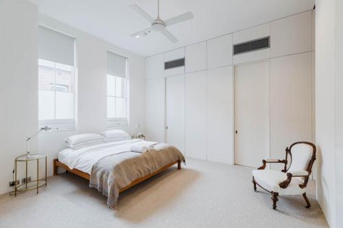 Spacious bedroom with built in robes at the Architect's Warehouse Apartment Fremantle